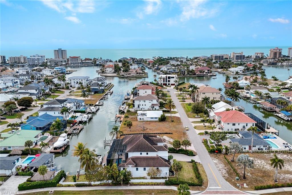494 Seagull Avenue Naples, FL 34108 - Photo 30 of 32 an aerial view of a city with lots of residential buildings