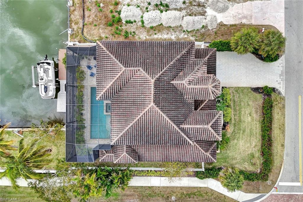 494 Seagull Avenue Naples, FL 34108 - Photo 31 of 32 a aerial view of a house with a garden and plants
