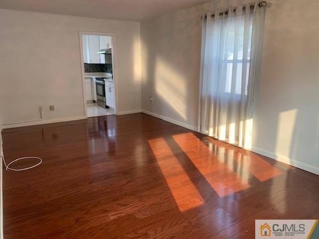 7 Gurley Road Edison, NJ 08817 - Photo 3 of 25 a view of a hallway with wooden floor