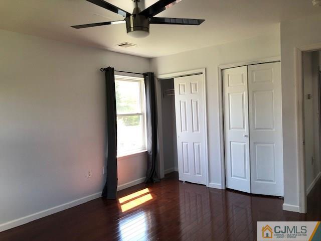 7 Gurley Road Edison, NJ 08817 - Photo 22 of 25 an empty room with wooden floor and windows