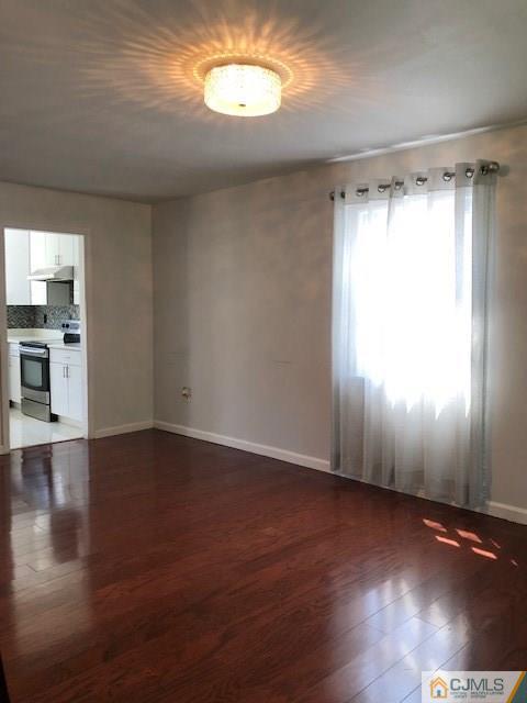 7 Gurley Road Edison, NJ 08817 - Photo 4 of 25 a view of a room with wooden floor and window