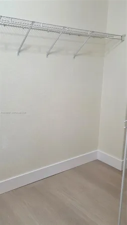 a view of a room with racks on the wall