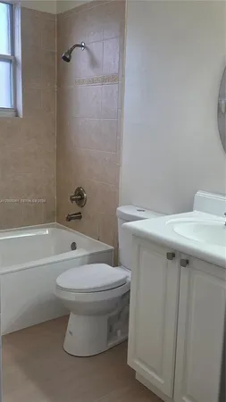a bathroom with a sink toilet and bathtub