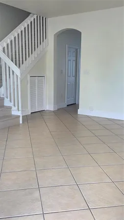a view of a livingroom with a staircase