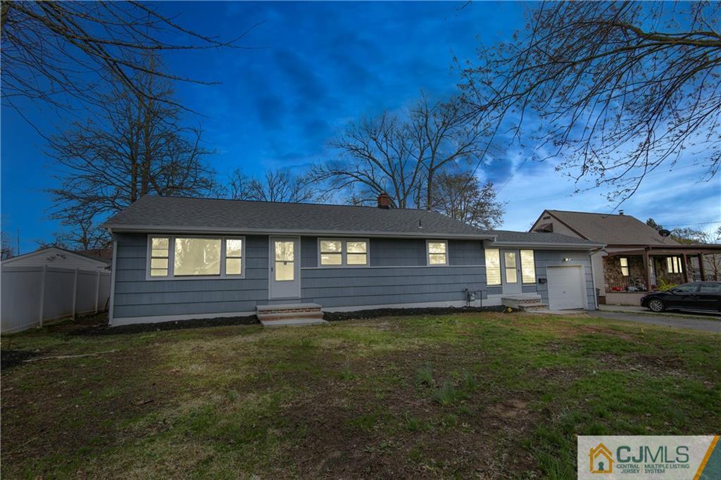 102 Magnolia Road Iselin, NJ 08830 - Photo 2 of 36 a front view of a house with a garden
