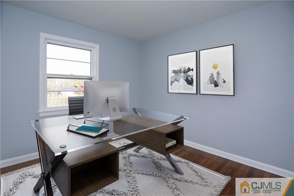 102 Magnolia Road Iselin, NJ 08830 - Photo 12 of 36 a view of a workspace with a table and chair in a room