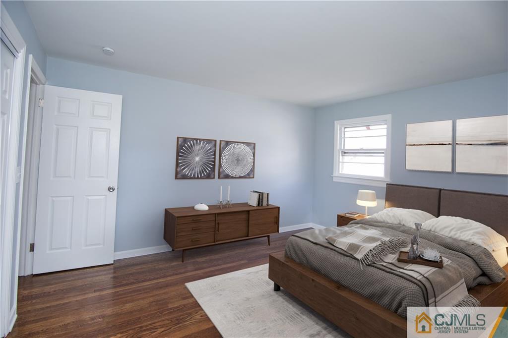 102 Magnolia Road Iselin, NJ 08830 - Photo 14 of 36 a bedroom with a bed and window