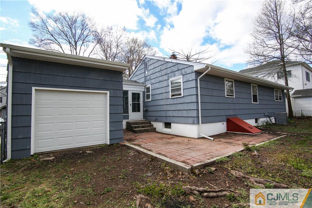 102 Magnolia Road Iselin, NJ 08830 - Photo 15 of 36 a view of a small house with a small barn