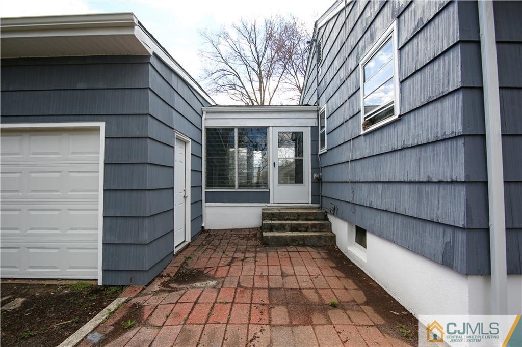 102 Magnolia Road Iselin, NJ 08830 - Photo 16 of 36 a view of a house with a door and wooden floor