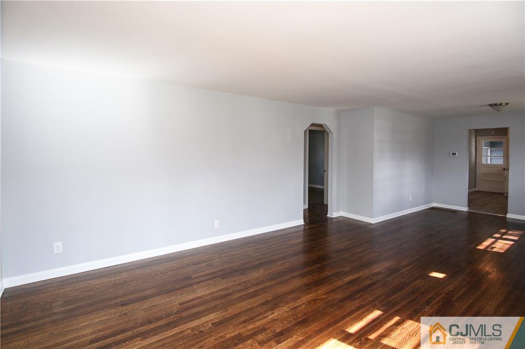102 Magnolia Road Iselin, NJ 08830 - Photo 19 of 36 a view of an empty room and wooden floor