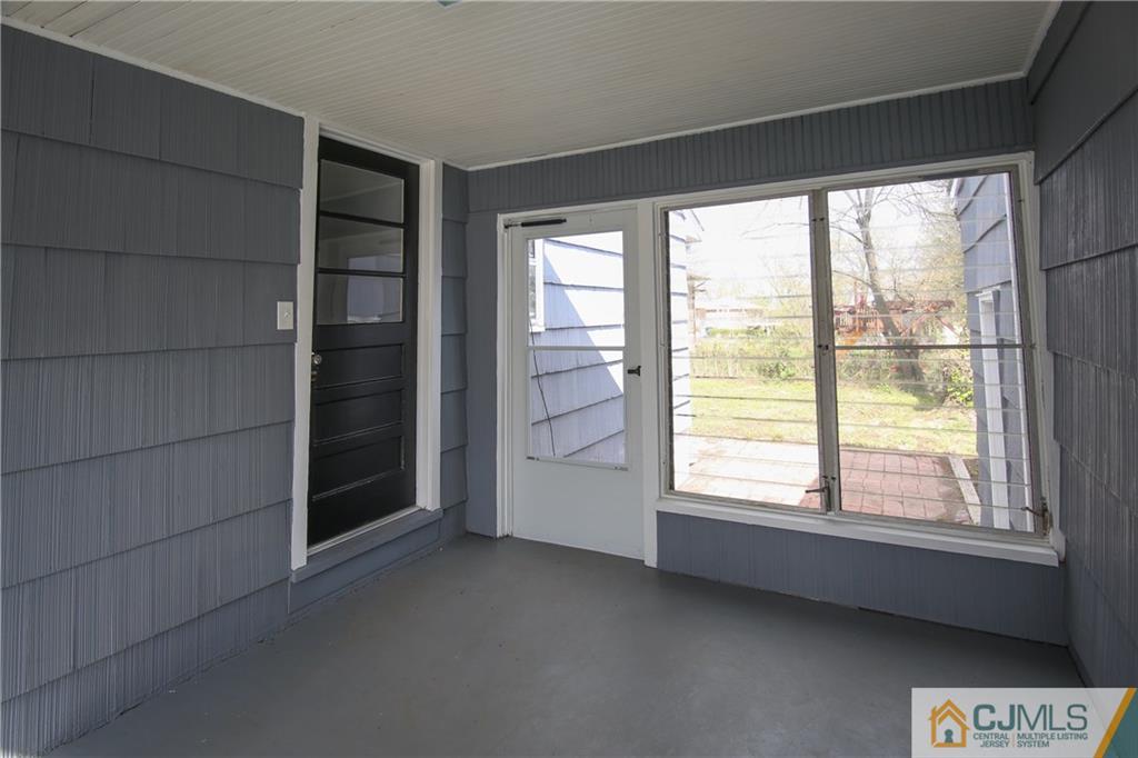 102 Magnolia Road Iselin, NJ 08830 - Photo 3 of 36 a view of empty room with windows and walls