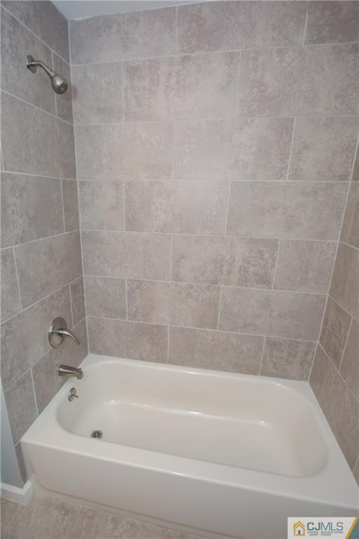 102 Magnolia Road Iselin, NJ 08830 - Photo 25 of 36 a bathroom with a bathtub