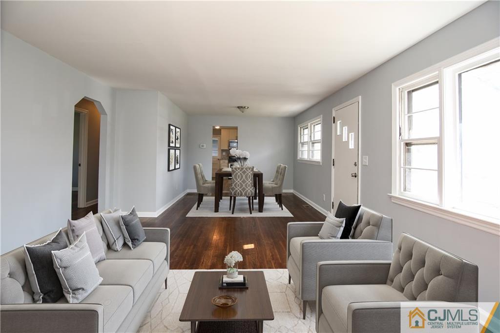 102 Magnolia Road Iselin, NJ 08830 - Photo 8 of 36 a living room with furniture and a large window