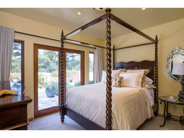 3027 Sherman Road Pebble Beach, CA 93953 - Photo 15 of 25 a bedroom with a large bed and a window
