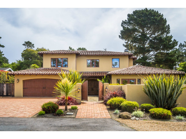3027 Sherman Road Pebble Beach, CA 93953 - Photo 25 of 25 a front view of a house with a garden