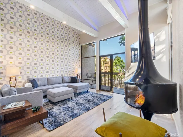 a living room with furniture and a lamp