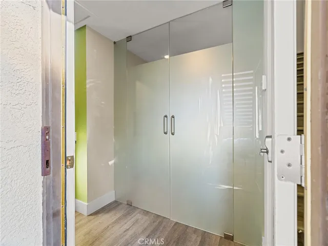 a view of a entryway door with wooden floor