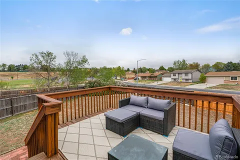 a view of a two chairs on the roof deck