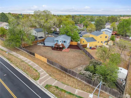 an aerial view of a house with a ocean view