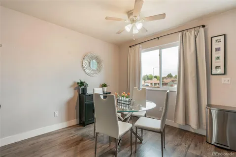 a view of a dining room with furniture window and wooden floor