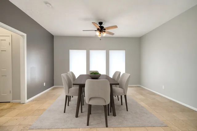 a dining room with furniture and window