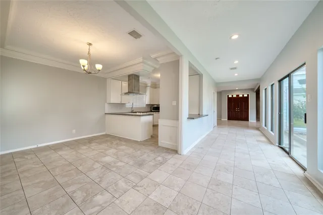 a view of a kitchen with a sink and a refrigerator cabinets
