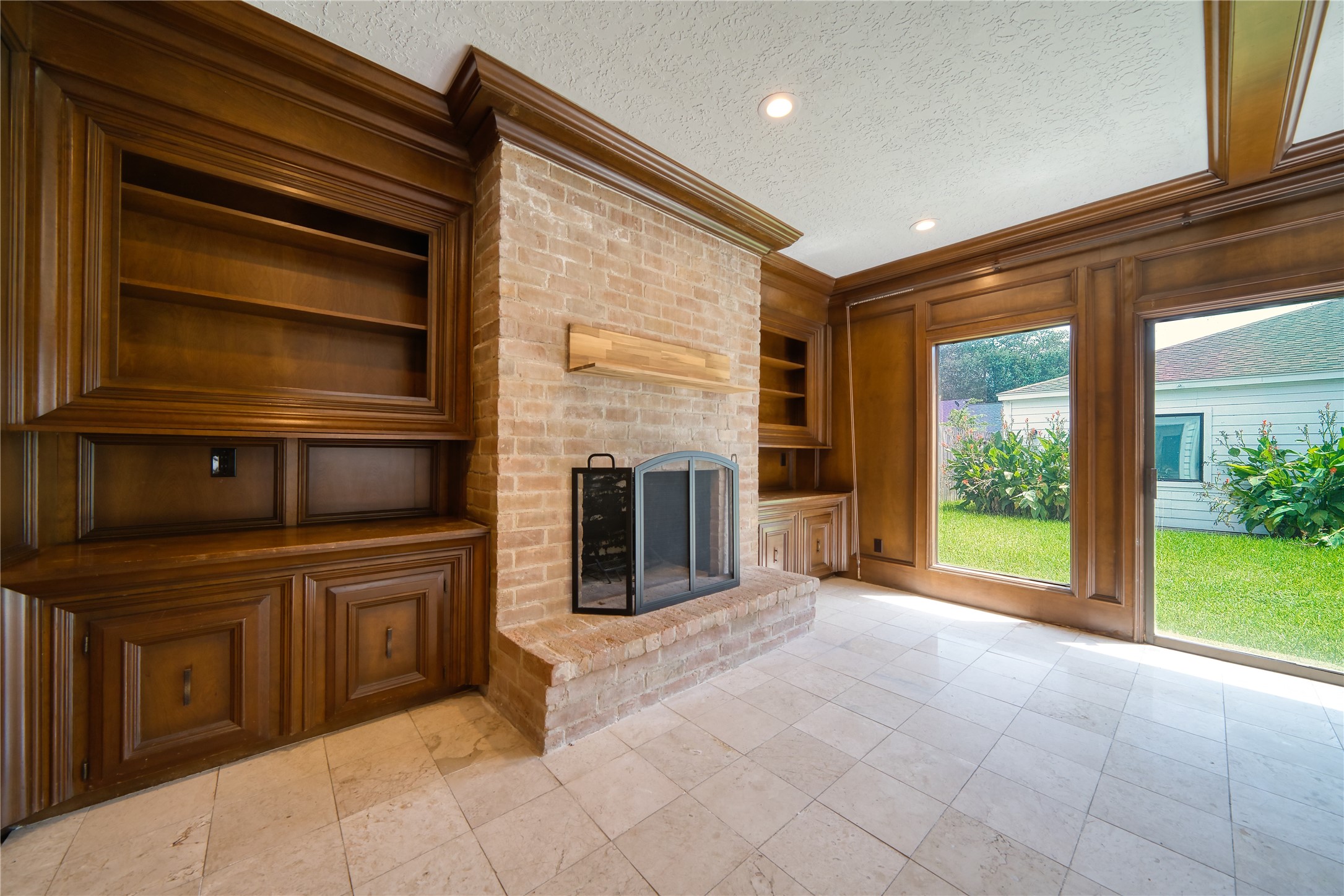10919 Villa Lea Lane Houston, TX 77071 - Photo 10 of 45 a view of a kitchen with a sink and a fireplace