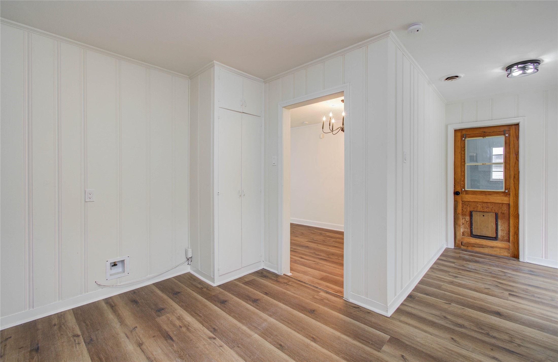 2417 Pecan Street Dickinson, TX 77539 - Photo 27 of 43 a view of a hallway with wooden floor and entryway