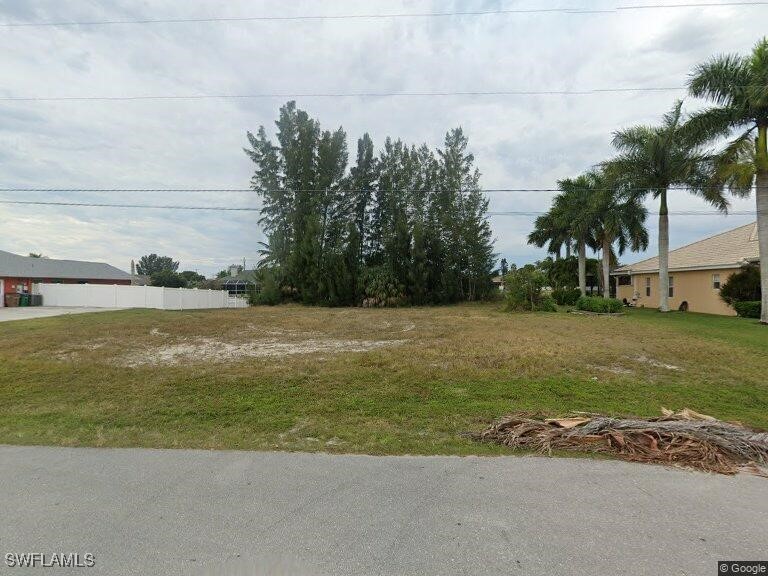 1318 Southwest 4th Avenue Cape Coral, FL 33991 - Photo 14 of 16 a view of a terrace with a yard