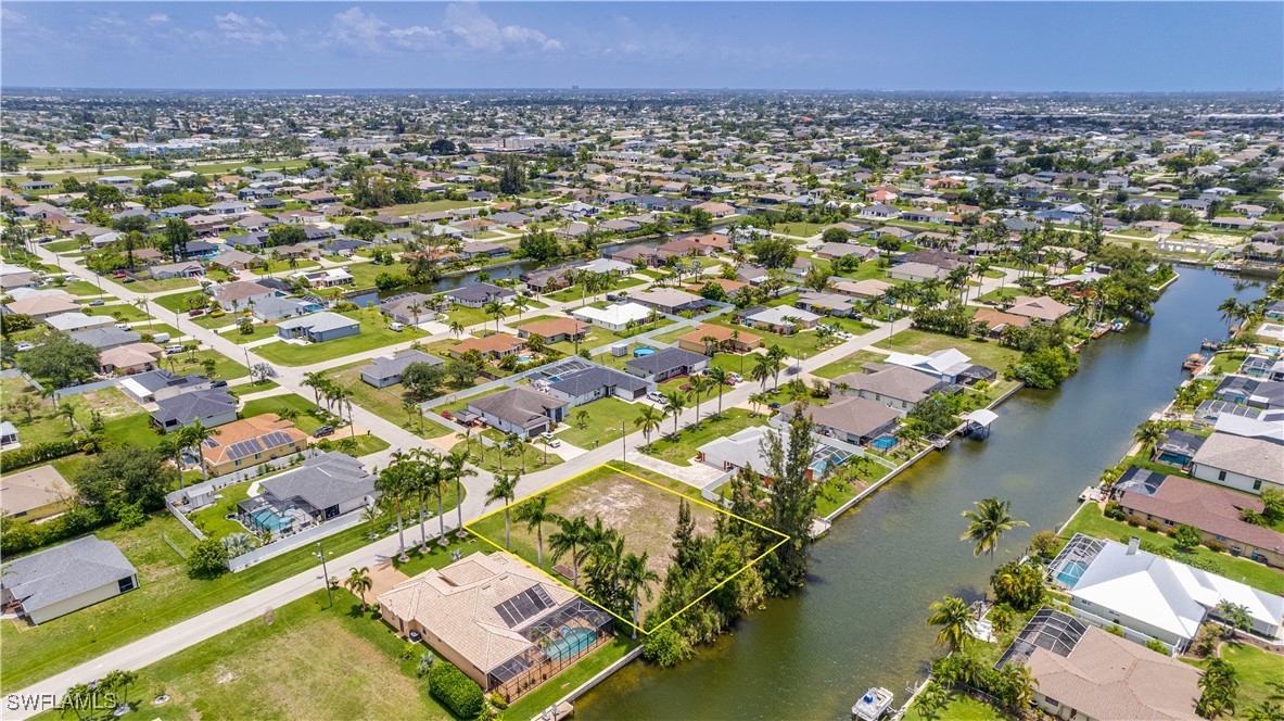 1318 Southwest 4th Avenue Cape Coral, FL 33991 - Photo 6 of 16 an aerial view of residential houses with outdoor space and river