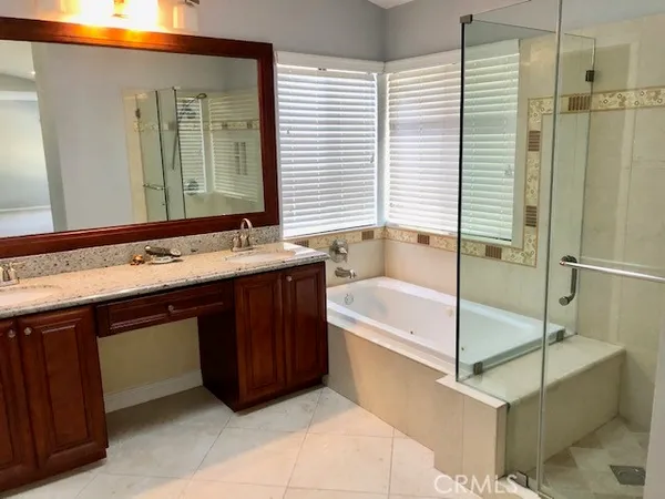 a bathroom with a bathtub and a sink
