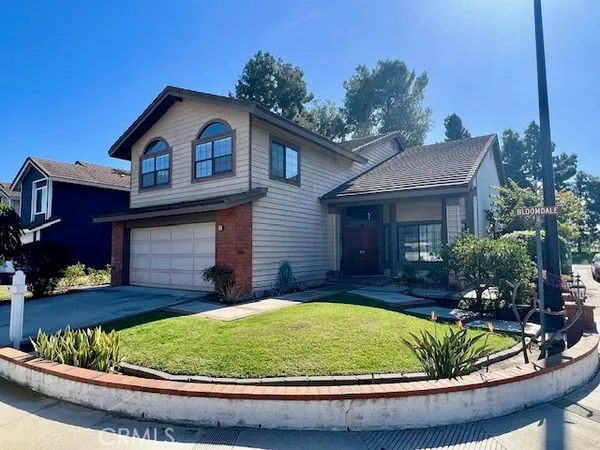 a view of house with outdoor seating area