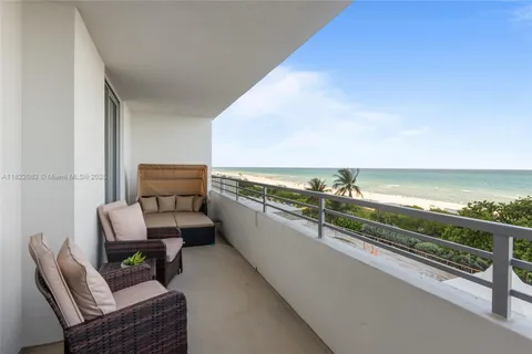 a room with furniture and a large window