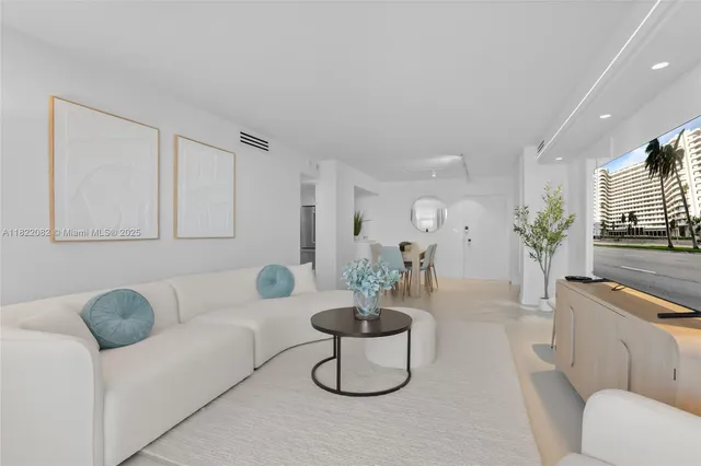 a living room with furniture fireplace and flat screen tv