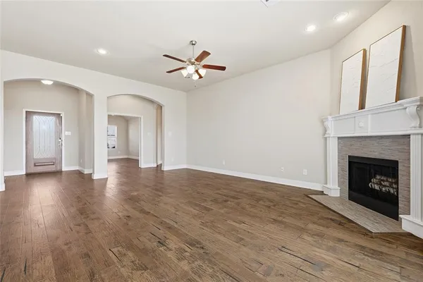 a view of a kitchen with a sink cabinets and a fireplace