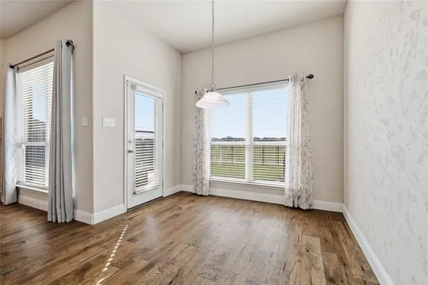 a kitchen with a sink appliances and cabinets