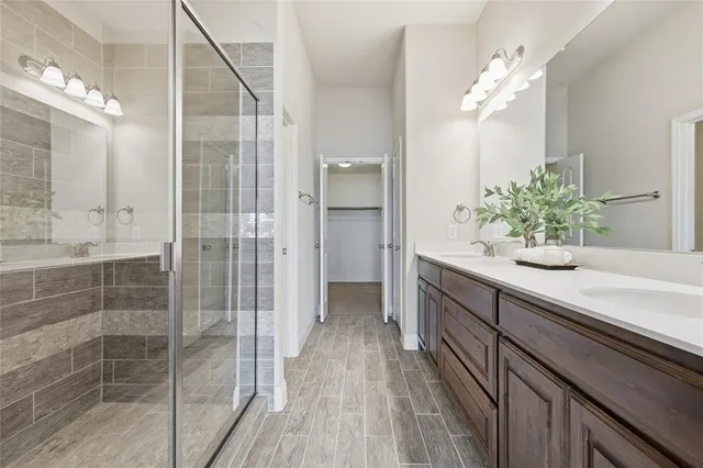 an empty room with chandelier fan and windows