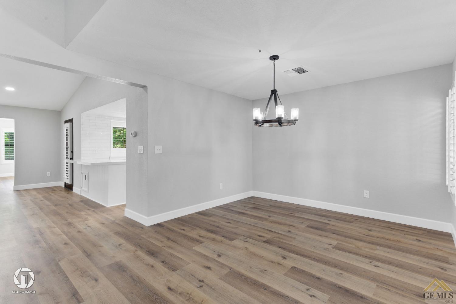 Undisclosed Address Bakersfield, CA 93308 - Photo 12 of 48 wooden floor in an empty room with a window