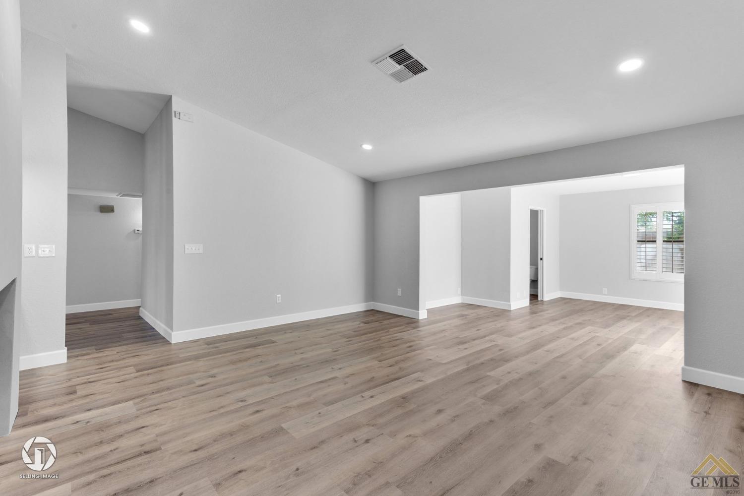 Undisclosed Address Bakersfield, CA 93308 - Photo 14 of 48 a view of an empty room with wooden floor and closet