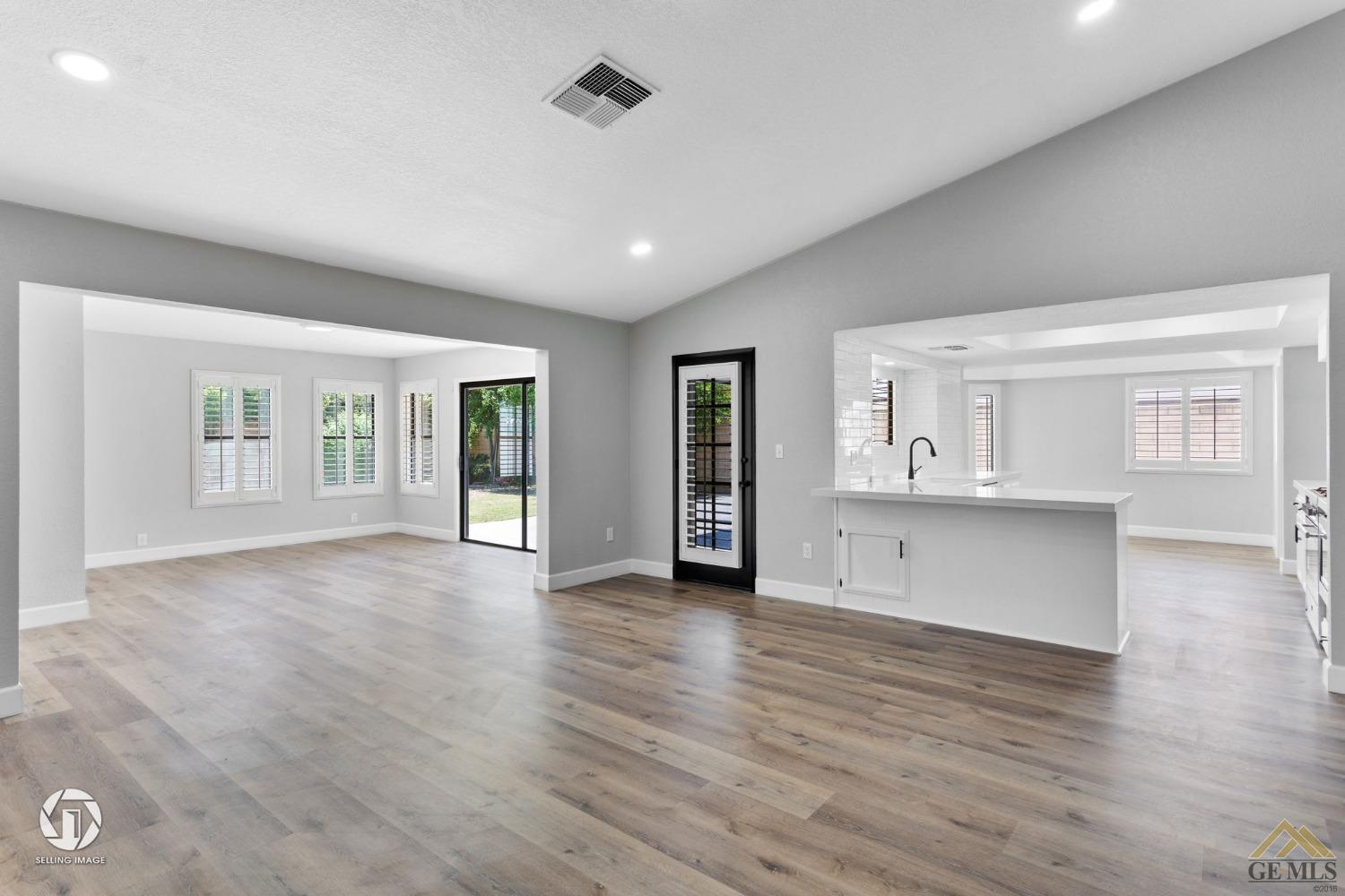 Undisclosed Address Bakersfield, CA 93308 - Photo 16 of 48 a view of an empty room with window and wooden floor