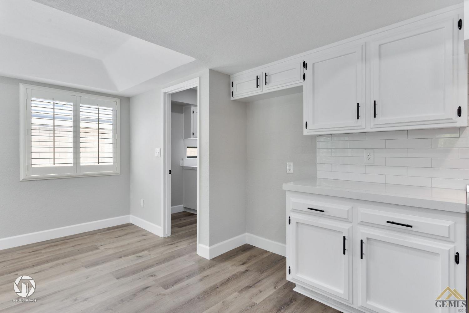 Undisclosed Address Bakersfield, CA 93308 - Photo 28 of 48 a view of kitchen with wooden floor and electronic appliances