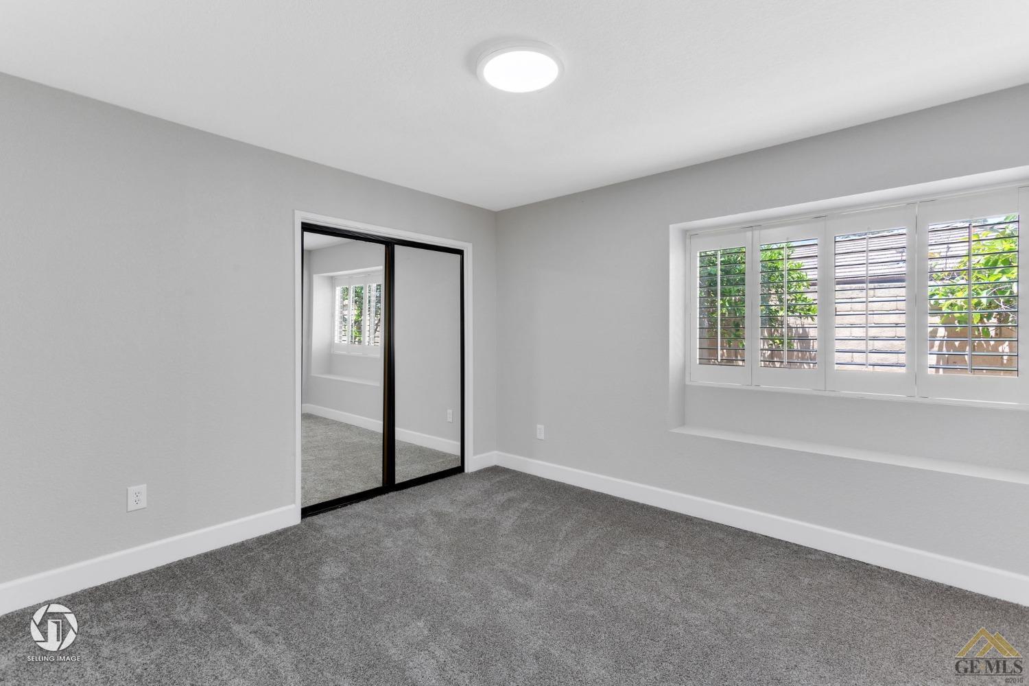 Undisclosed Address Bakersfield, CA 93308 - Photo 41 of 48 an empty room with windows and closet