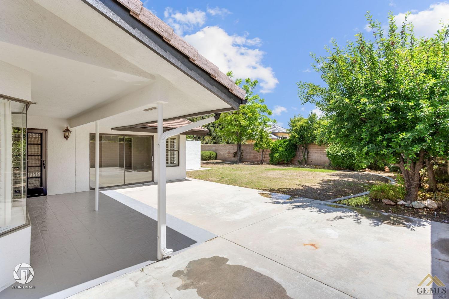 Undisclosed Address Bakersfield, CA 93308 - Photo 45 of 48 a view of a house with backyard and a tree