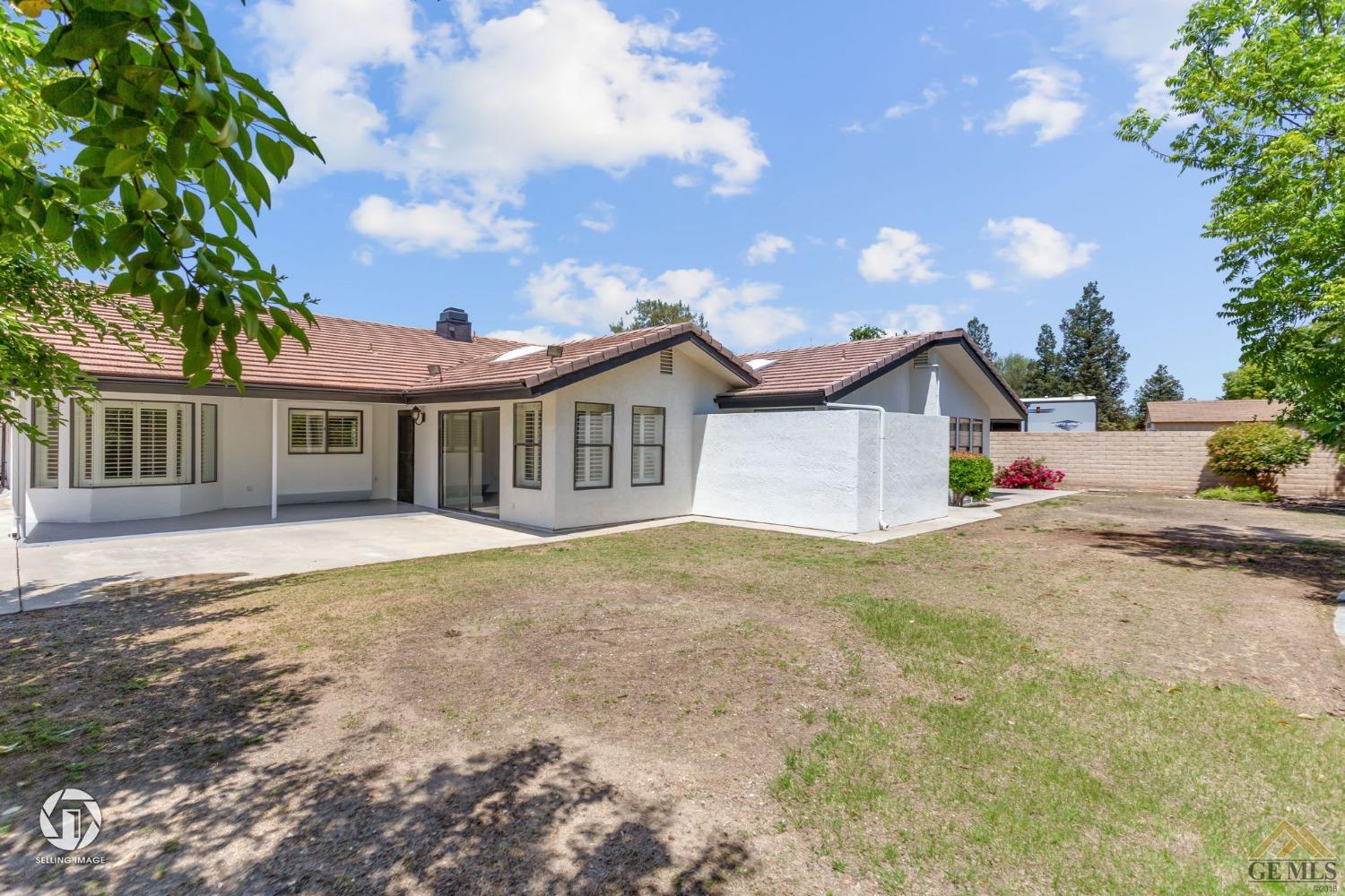 Undisclosed Address Bakersfield, CA 93308 - Photo 46 of 48 a front view of a house with a garage