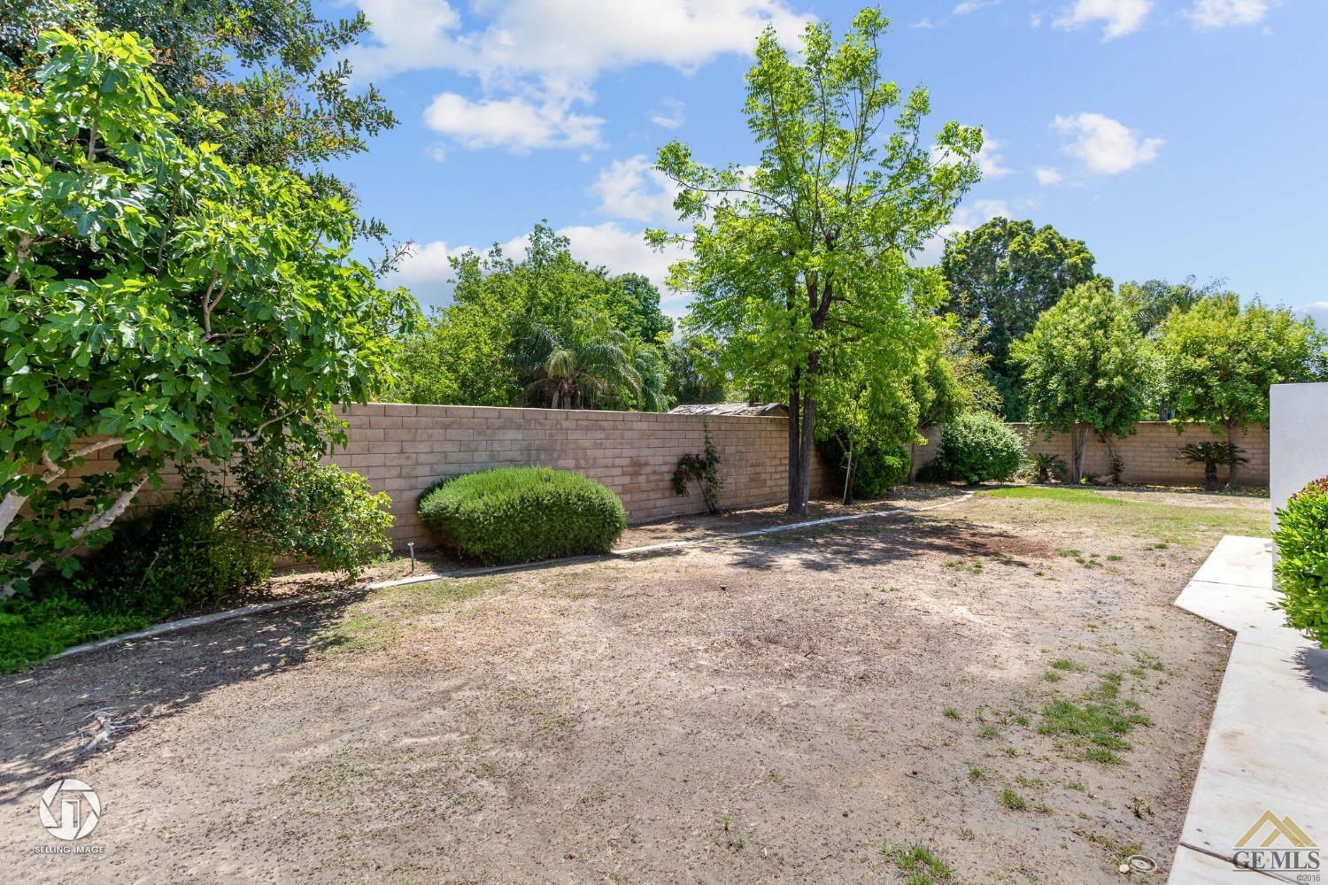Undisclosed Address Bakersfield, CA 93308 - Photo 47 of 48 a backyard of a house with lots of green space