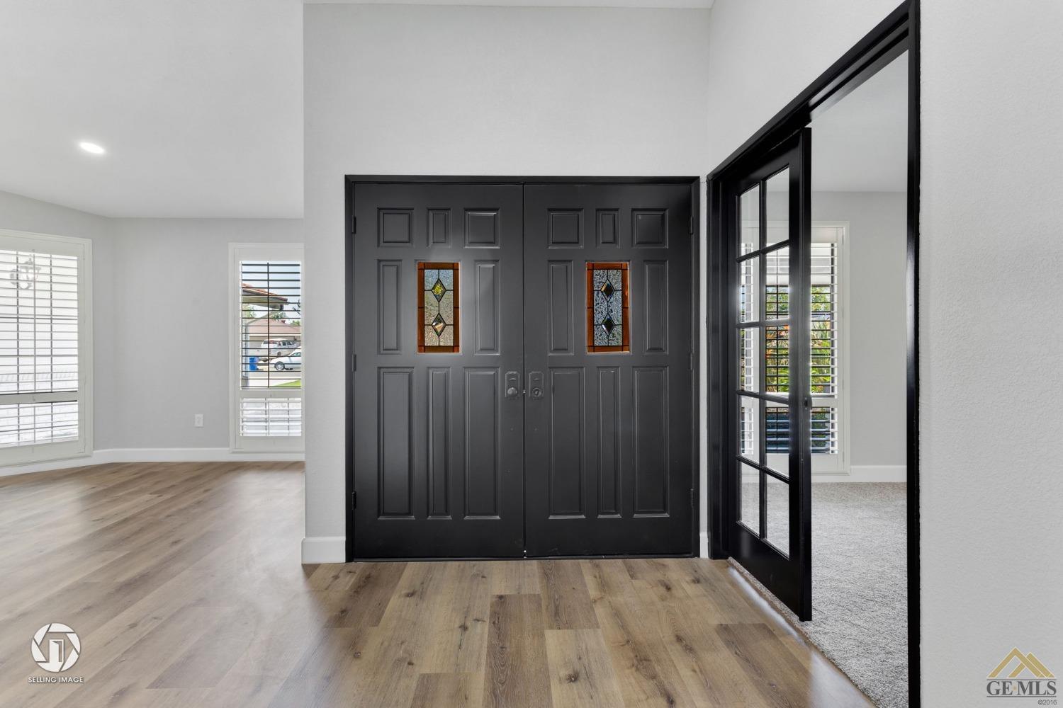 Undisclosed Address Bakersfield, CA 93308 - Photo 5 of 48 a view of entryway with wooden floor and stairs