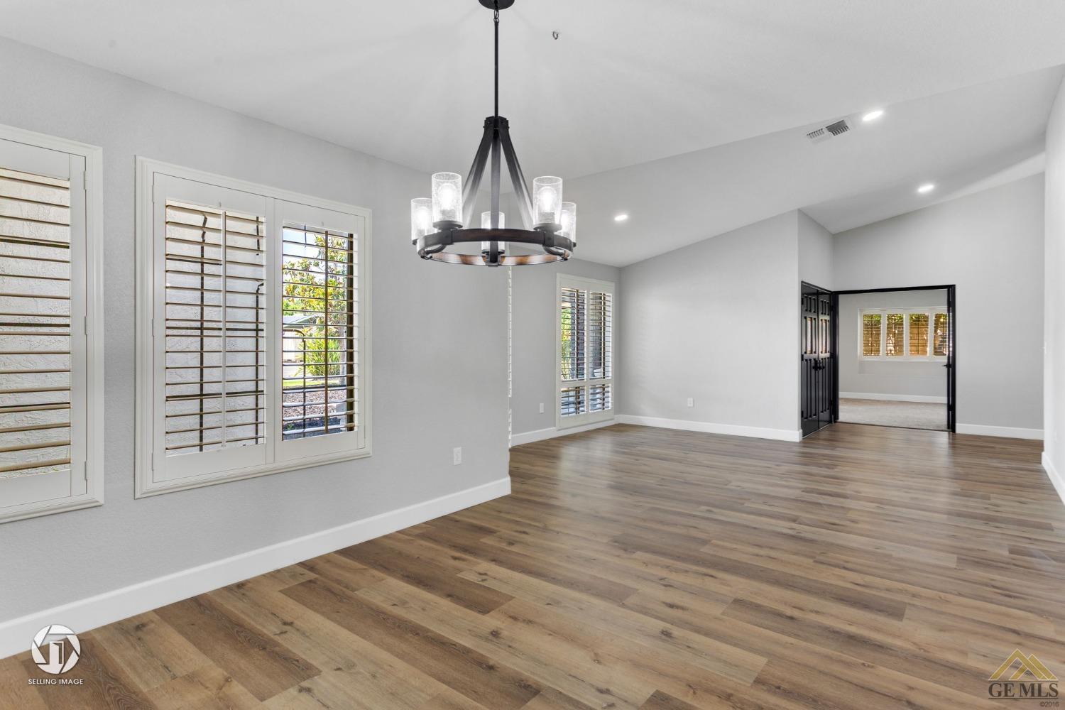 Undisclosed Address Bakersfield, CA 93308 - Photo 9 of 48 a view of empty room with wooden floor and fan