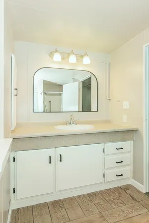 a bathroom with a bathtub and a shower