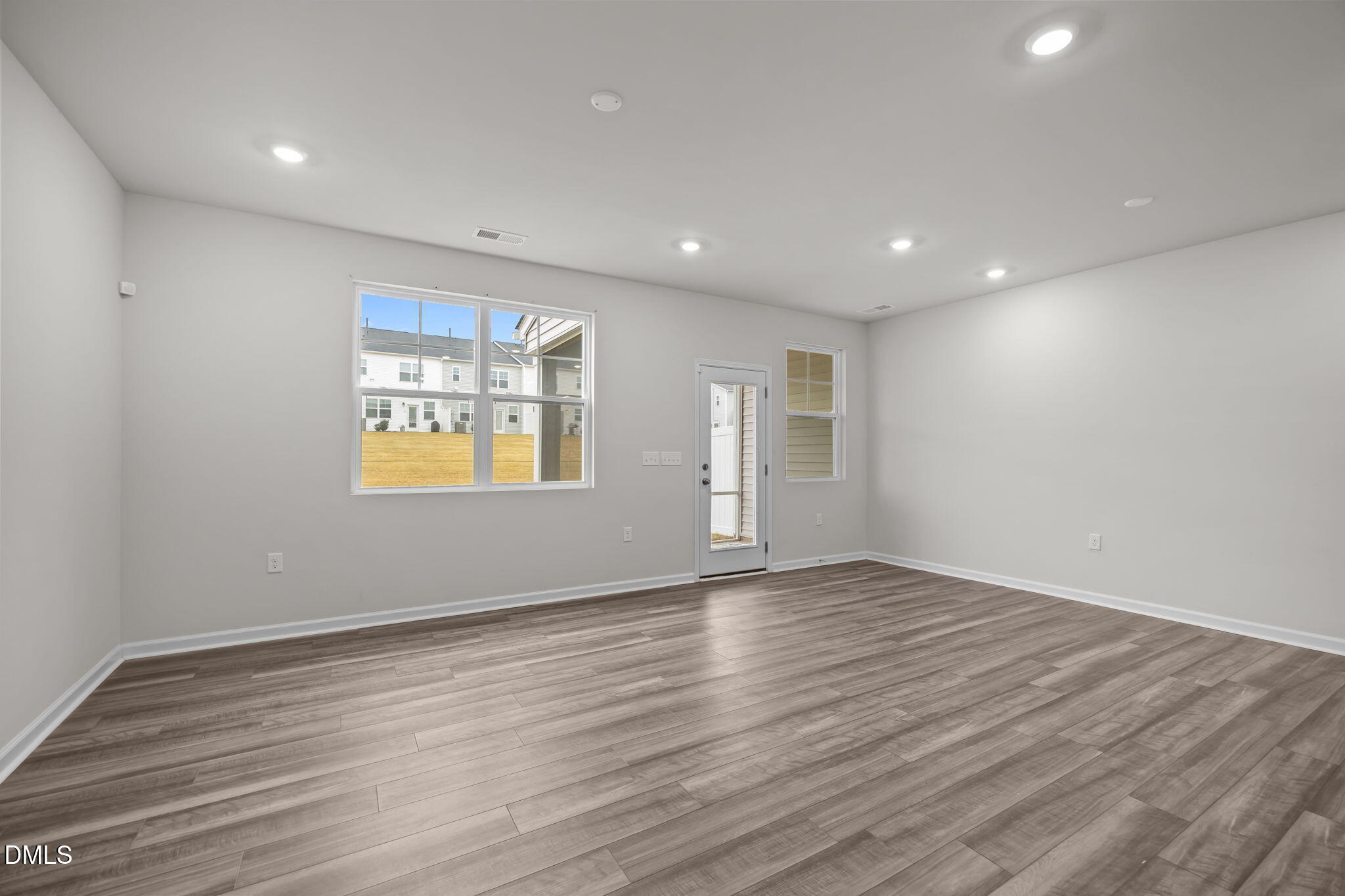 5016 Kota Street Raleigh, NC 27610 - Photo 26 of 37 a view of an empty room with wooden floor and a window