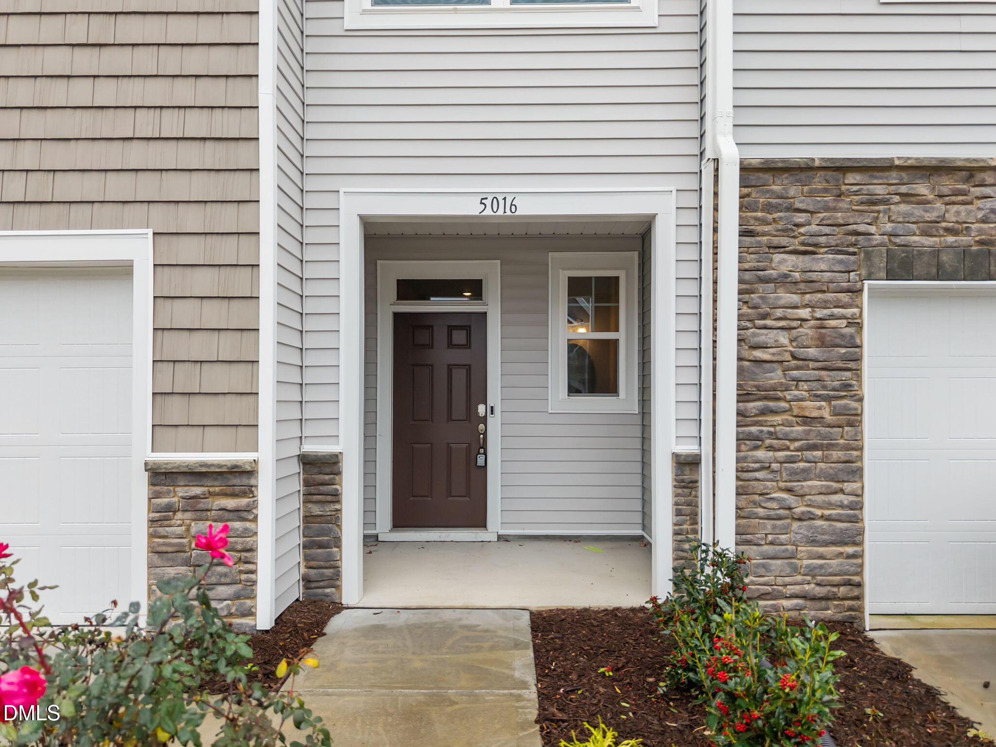 5016 Kota Street Raleigh, NC 27610 - Photo 2 of 37 a front view of a house with a garage